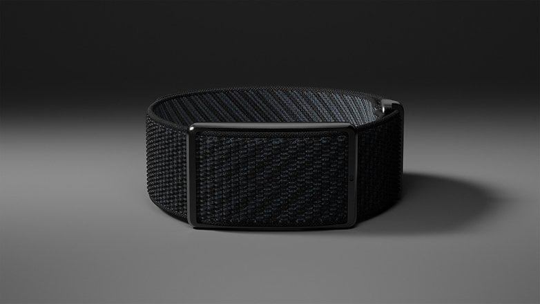 A black woven fitness tracker with a rectangular display. A black woven fitness tracker with a rectangular display.