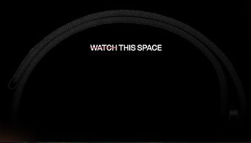 Black strap against a dark background with the text 'WATCH THIS SPACE' prominently displayed.