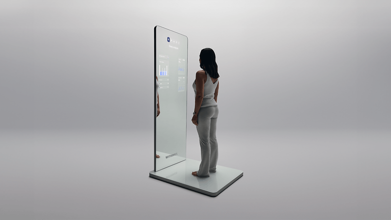 A person stands in front of a smart mirror displaying health data.