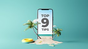 A smartphone in a beach scenario with a "Top 9 Tips" sentence on the display