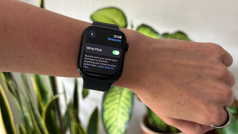 A close-up of an Apple Watch Series 9 displaying 'Wrist Flick' settings.