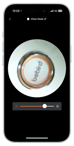 Close-up of a Bebird device with a control slider and a clean mode indicator on a smartphone screen.