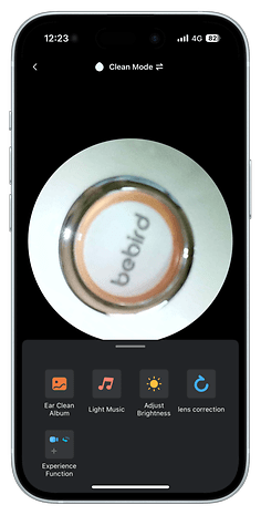 Close-up of a Bebird device interface showing options like 'Ear Clean Album' and 'Adjust Brightness'.