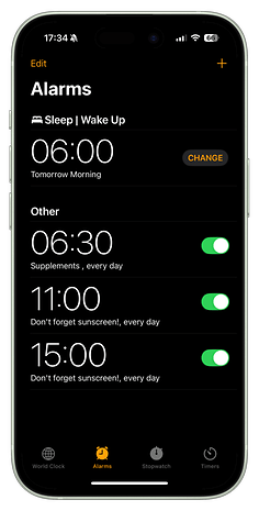 Alarm clock interface showing wake-up time at 6:00 and reminders for sunscreen at 11:00 and 15:00.