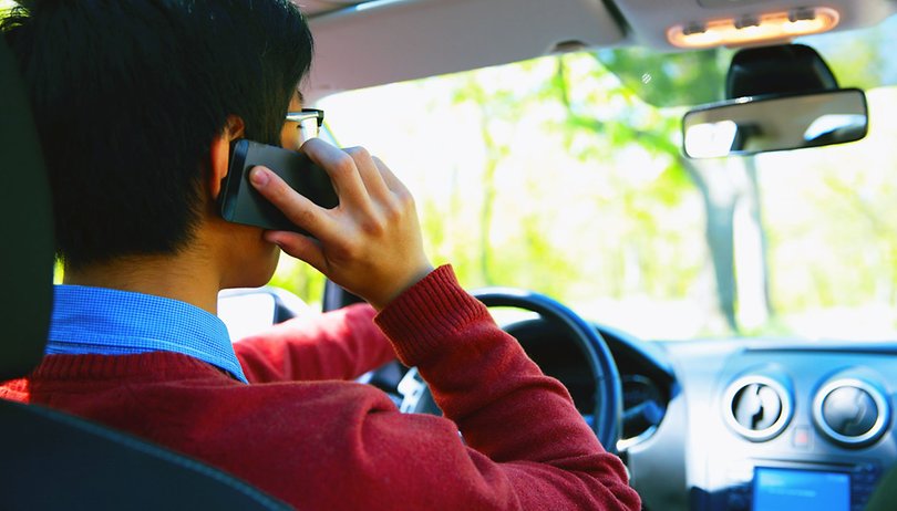 graphicstock young man on phone in car