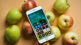 Apple iPhone 8 on background with apples