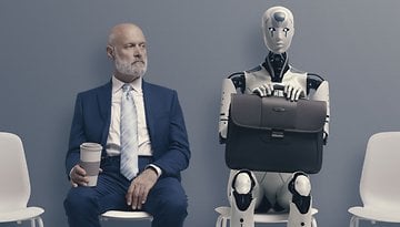 Person and Roboter sitting on chairs