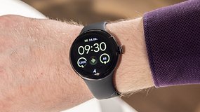 Front view of the Google Pixel Watch 2 worn on a straight wrist with its screen switched on.