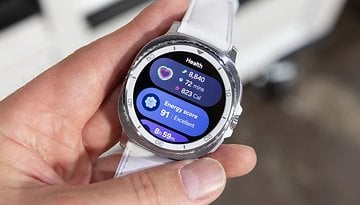 A person holding a Samsung Galaxy Watch 8 Classic displaying health metrics and energy score.