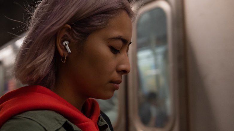 A person in the metro station wearing AirPods