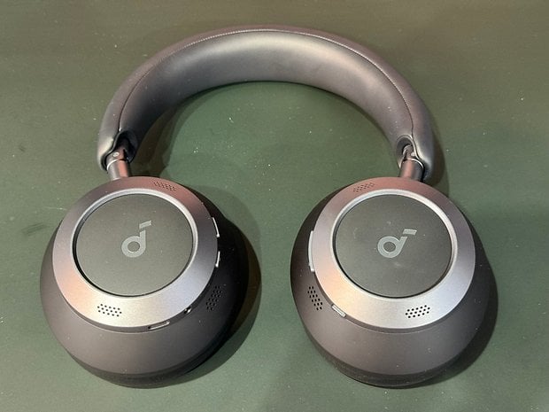 The Soundcore Space One Pro Bluetooth headphones as seen from above as it lays flat on a table.