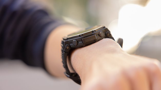 A close-up of a black Amazfit T-Rex Pro 3 smartwatch on a wrist.