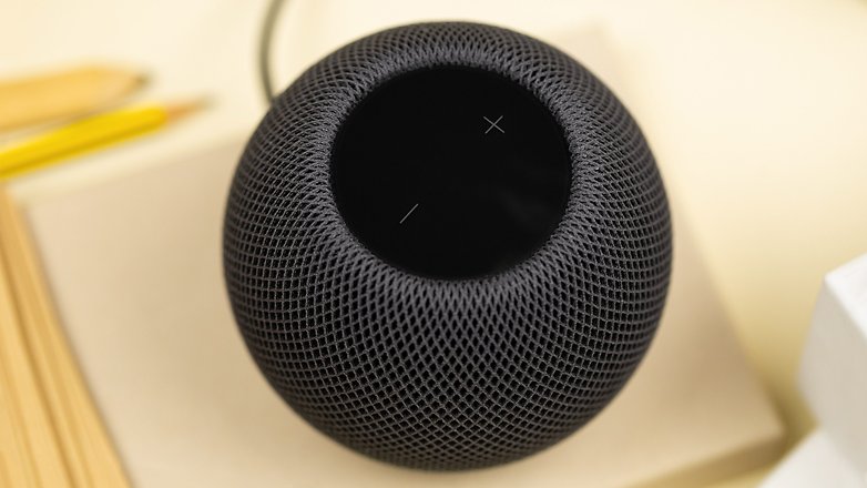 The touch screen of the HomePod mini highlighted showing the volume buttons in detail.