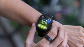 A close-up of an Apple Watch displaying a battery level of 86% and a low power mode notification.