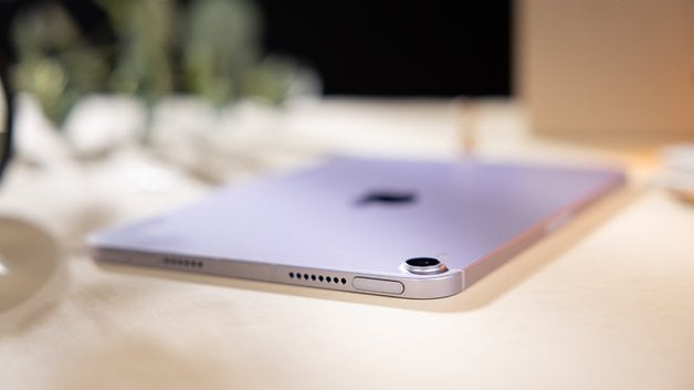 Apple iPad Mini 7 in purple color, showing the back and camera on a table.