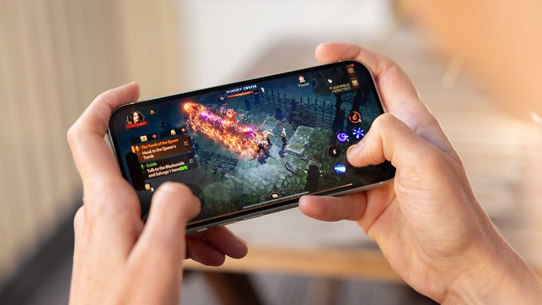 A person playing Diablo Imortal on an Apple iPhone 15