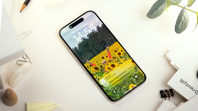 Apple iPhone 15 Pro display with a colorful background