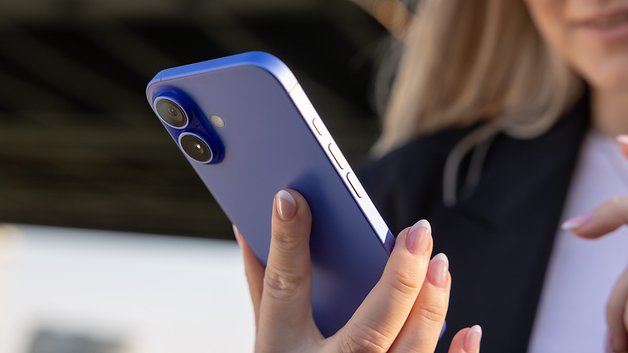 iPhone 16 in blue color held in hand.