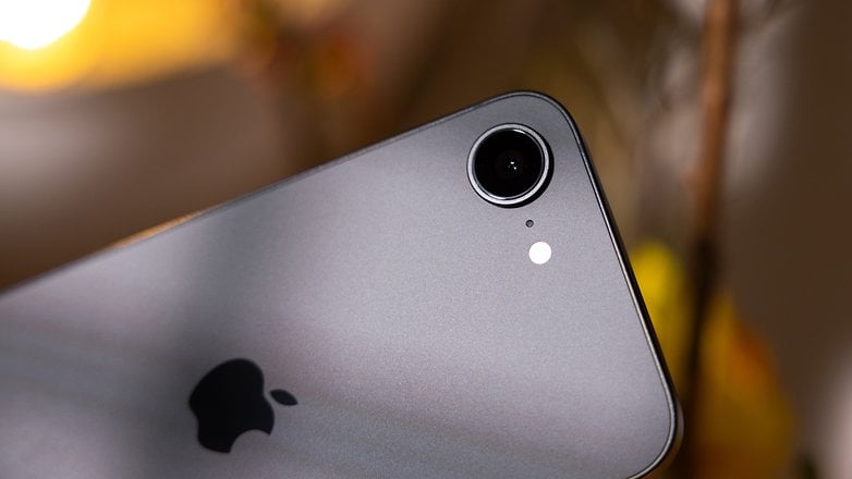 Close-up of an Apple iPhone 16e camera with a silver finish and the Apple logo. Close-up of an Apple iPhone 16e camera with a silver finish and the Apple logo.