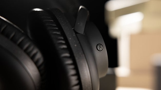 The Audio-Technica ATH-S300BT headphones with a closer look at its Active Noise Cancellation button.