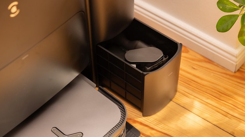 The base station has a storage compartment to store the cordless vacuum cleaner's attachments.