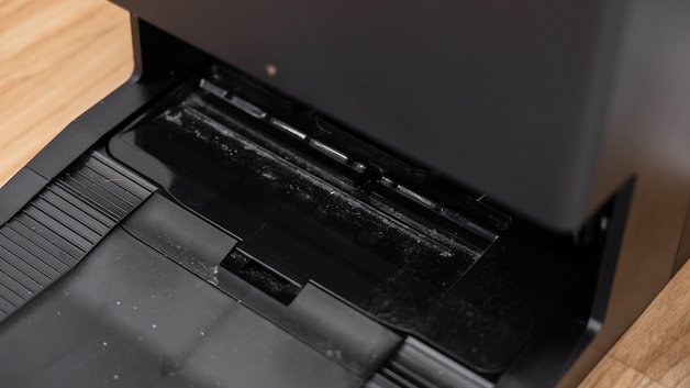 Close up of the Ecovacs Deebot X8 Pro Omni's dust bin showing dirt buildup.
