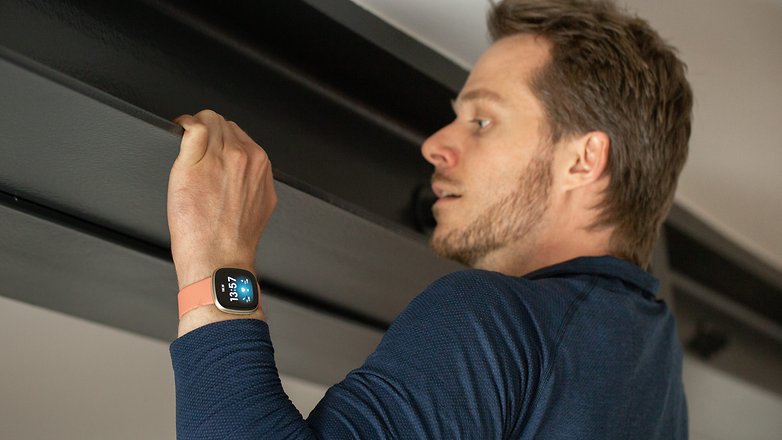 A person wearing the Fitbit Versa 3 smartwatch in a workout session