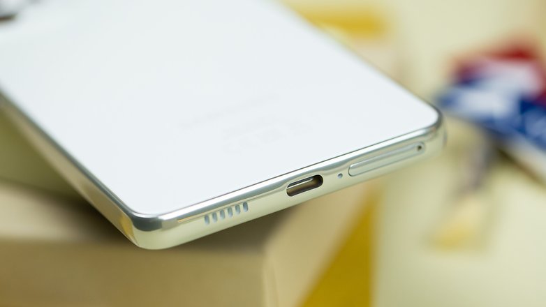Samsuns Galaxy A53 bottom view with speaker grille, USB-C port, and SIM card tray