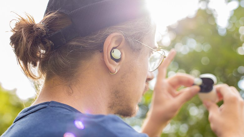 Google Pixel Buds being used by a person
