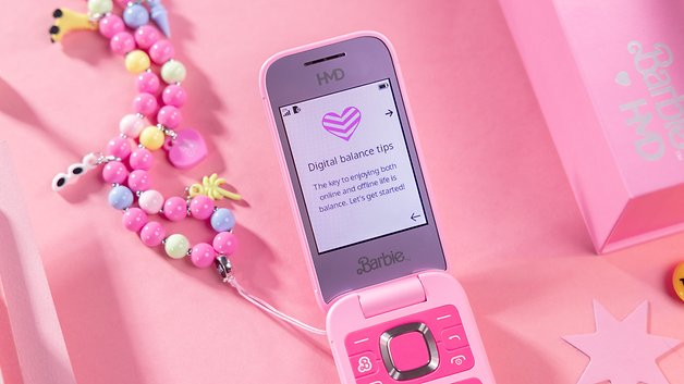 A pink Barbie HMD phone displaying 'Digital Balance Tips' on the screen.