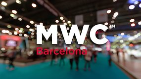 The MWC logo highlighted in an image with people walking in the halls of Fira Gran Via in Barcelona