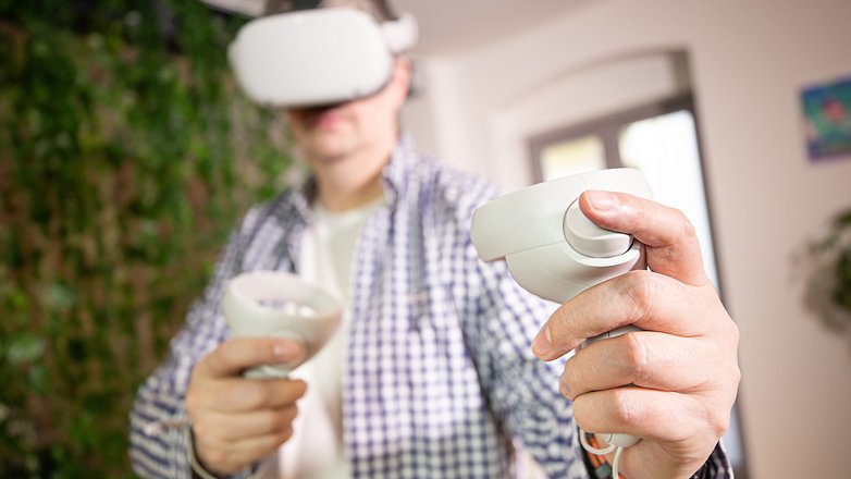 A person wearing the Meta Quest 2 and playing a virtual Reality game
