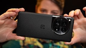 A person holding the OnePlus 12 highlighting the camera module