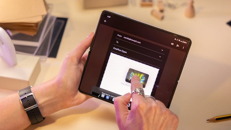 A person attaching images to an email on the OnePlus Open main display