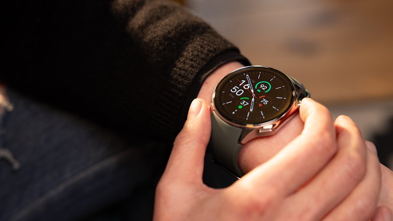 A person using the crown button of the OnePlus Watch 2