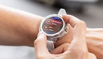 A person interacting with a Samsung Galaxy Watch 8 Classic displaying health metrics.