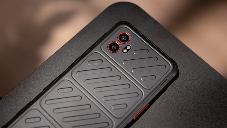 Close-up of a Samsung Galaxy XCover 7 Pro smartphone with a textured back and dual cameras. Close-up of a Samsung Galaxy XCover 7 Pro smartphone with a textured back and dual cameras.