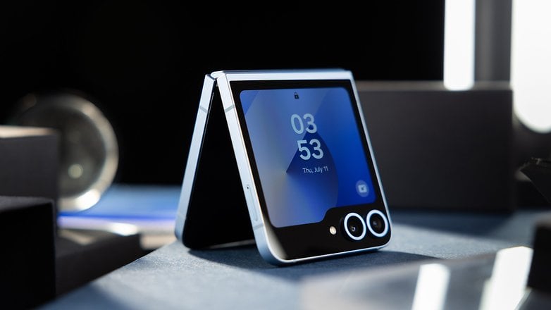 A half folded Samsung Galaxy Z Flip 6 in the standing position on a table