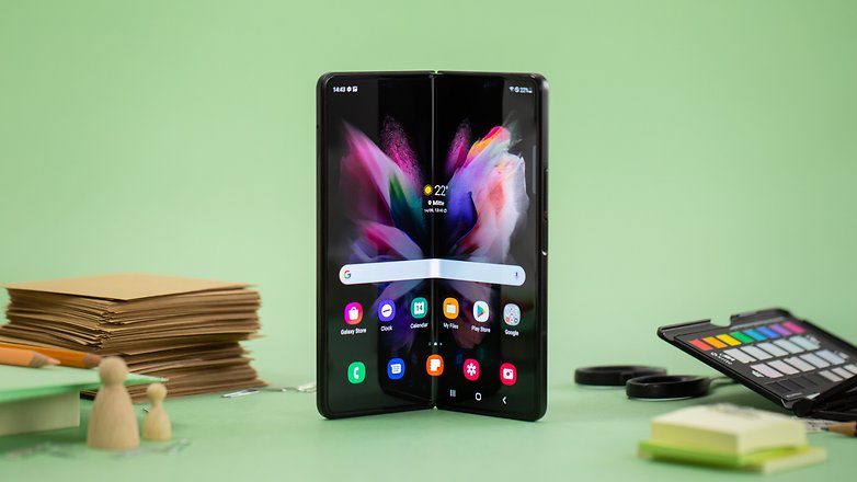 Opened Galaxy Z Fold 3 stands on a table