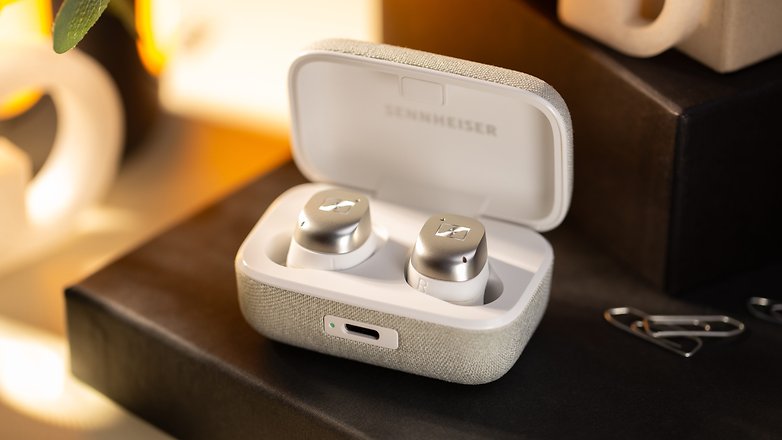 Sennheiser Momentum True Wireless 4 earbuds inside the opened charging case showing the USB-C charging port