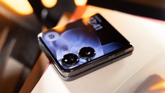 The Xiaomi Mix Flip smartphone with a bright display and its two round lenses.