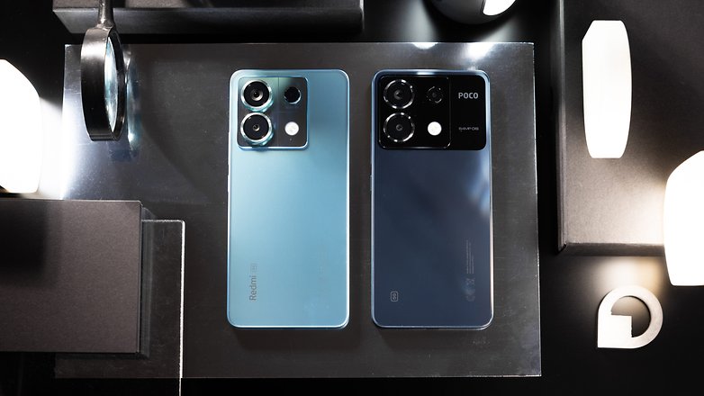 Redmi Note 13 Pro 5G (left), next to the Poco X6 (right) over a table.