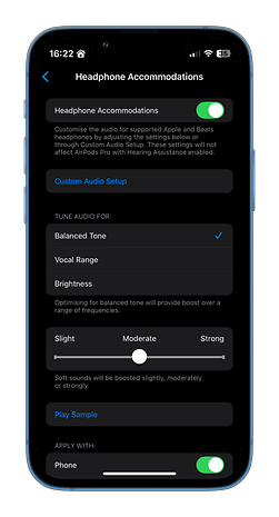 Headphone accommodations settings on an iPhone for AirPods, with options for audio tuning and application settings.