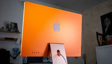 Orange Apple iMac M4 2024 seen from the back with the Apple logo visible.