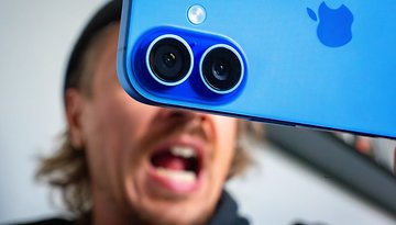 Close-up of a blue Apple iPhone 16 camera with a person shouting in the background.