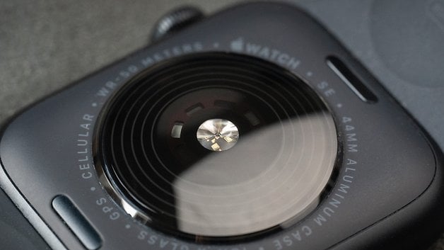 Close-up of the back of an Apple Watch SE 3 showing its sensors in detail.