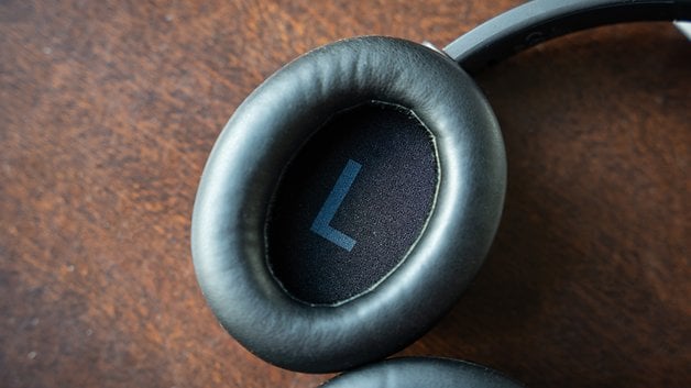 Close-up of the left ear cup's pad of the EarFun Tune Pro headphones the 'L' indicating it as left.
