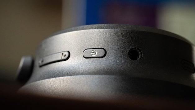 Close-up of the EarFun Tune Pro's controls with buttons and a headphone jack.