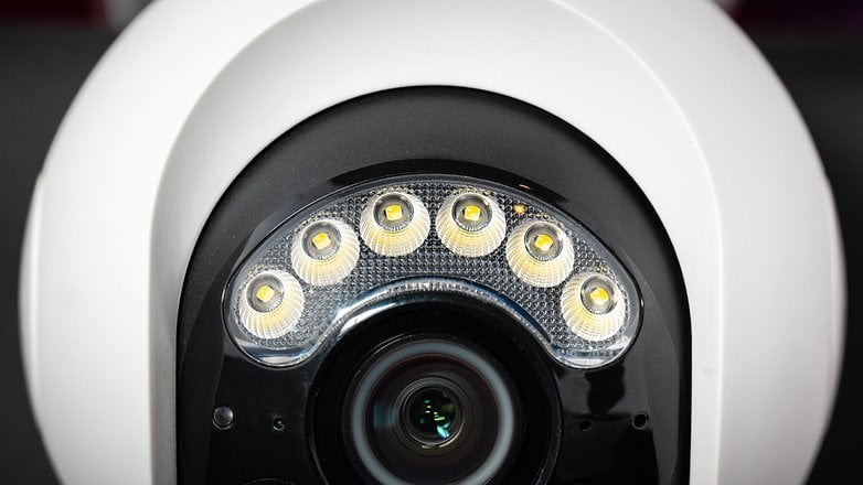 Close-up of a Reolink Atlas PT Ultra security camera featuring LED lights around the lens.