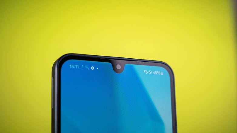 Close-up of a Samsung Galaxy A16 5G smartphone's top with a blue screen and a notch for the front camera.